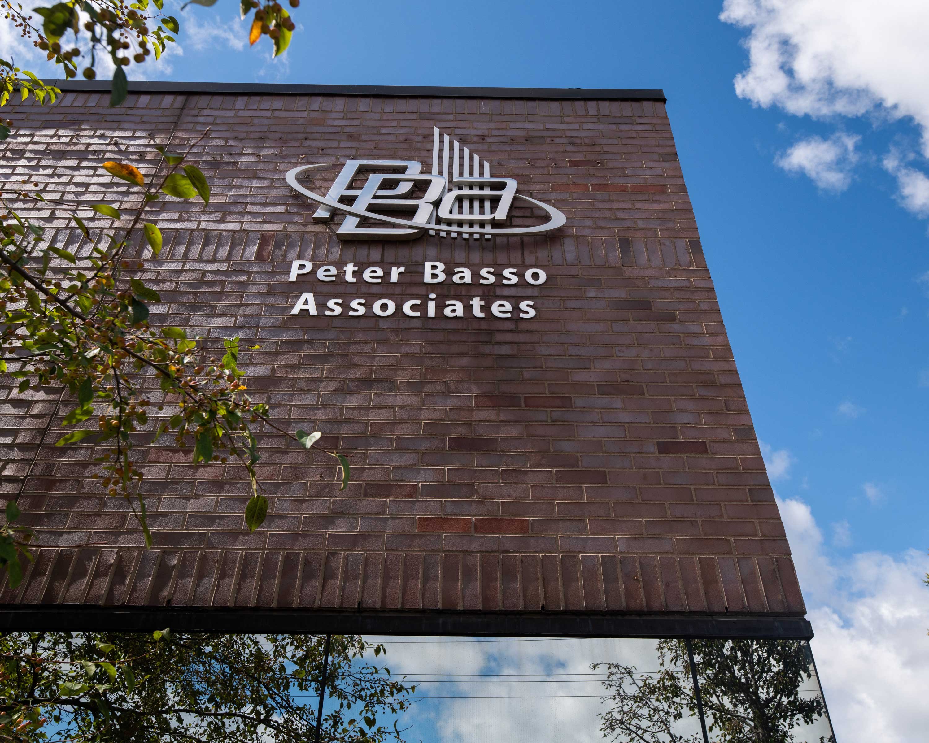 Peter_Basso_Associates_Logo_on_Building